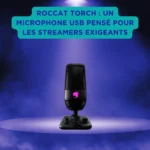 ROCCAT Torch : un microphone USB pensé pour les streamers exigeants Microphone USB Roccat Torch posé sur un socle, éclairé au centre d’une scène violette, encadré par de la fumée et un encart turquoise indiquant qu’il est conçu pour les streamers exigeants.