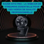 Razer Kiyo Pro : la webcam de streaming incontournable pour des vidéos de qualité professionnelle Webcam Razer Kiyo Pro posée sur un socle lumineux, dans un tunnel futuriste avec des anneaux orange, accompagnée d’un encart bleu vantant sa qualité professionnelle pour le streaming.