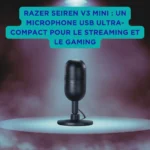 Razer Seiren V3 Mini : un microphone USB ultra-compact pour le streaming et le gaming Microphone USB Razer Seiren V3 Mini posé sur un socle au centre d’une scène éclairée, entouré de fumée et mis en avant par un projecteur, avec encart bleu vantant son ultra-compacité pour le streaming et le gaming.