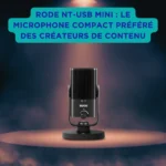 Rode NT-USB Mini : le microphone compact préféré des créateurs de contenu Microphone USB Rode NT-USB Mini posé sur un socle, éclairé par un projecteur au centre d’une scène sombre, accompagné d’un encart bleu turquoise vantant son succès auprès des créateurs de contenu.
